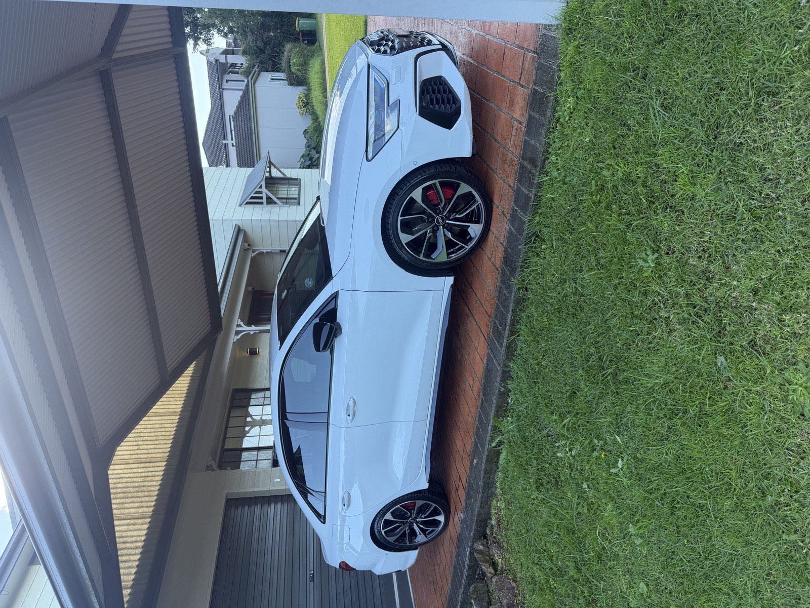 White Audi sedan showing its side windows